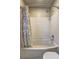 Bright bathroom with white subway tile, a curved tub, and floral shower curtain at 1160 Haven Brook Ne Way, Brookhaven, GA 30319