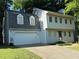Charming two-story home with a two-car garage, dormer windows, and a well-maintained lawn at 1160 Haven Brook Ne Way, Brookhaven, GA 30319