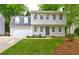Charming front exterior of a two-story home featuring a garage, well-kept lawn, and inviting curb appeal at 1160 Haven Brook Ne Way, Brookhaven, GA 30319