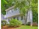Front exterior with mature landscaping, light colored siding, and an inviting entrance at 1160 Haven Brook Ne Way, Brookhaven, GA 30319