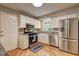 Well-appointed kitchen featuring stainless steel appliances, granite countertops, and bright white cabinetry at 1160 Haven Brook Ne Way, Brookhaven, GA 30319