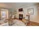 Bright and airy living room features a cozy fireplace and ample seating, perfect for entertaining at 1160 Haven Brook Ne Way, Brookhaven, GA 30319
