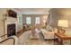 Inviting living room with hardwood floors, fireplace, and comfortable seating perfect for relaxation at 1160 Haven Brook Ne Way, Brookhaven, GA 30319