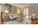 Comfortable living room boasts a staircase and plenty of natural light, creating a warm atmosphere at 1160 Haven Brook Ne Way, Brookhaven, GA 30319