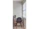 Functional office nook with white desk, gray chair, and natural light from a window at 1160 Haven Brook Ne Way, Brookhaven, GA 30319