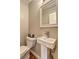 Modern powder room featuring pedestal sink, with a crisp, clean aesthetic at 1160 Haven Brook Ne Way, Brookhaven, GA 30319