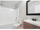 Clean bathroom featuring a bath tub, toilet, and vanity with a dark framed mirror at 20 Pine Canyon Sw Dr # 26, Atlanta, GA 30331