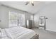 Bright bedroom with a ceiling fan, large window, and neutral decor at 20 Pine Canyon Sw Dr # 26, Atlanta, GA 30331