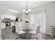 Dining area with a glass table, modern chairs, and hardwood floors at 20 Pine Canyon Sw Dr # 26, Atlanta, GA 30331