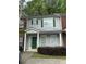 Charming townhouse with gray siding, green shutters, and a well-maintained front yard at 20 Pine Canyon Sw Dr # 26, Atlanta, GA 30331