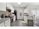 Bright kitchen with stainless steel appliances, granite countertops, and white cabinets at 20 Pine Canyon Sw Dr # 26, Atlanta, GA 30331