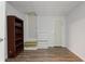 Finished basement with hardwood floors, stairs, bookshelf and two doors at 213 Johnstons Dr, Dallas, GA 30157