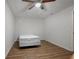 Finished basement area with hardwood floor and basic bed at 213 Johnstons Dr, Dallas, GA 30157
