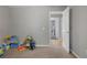 Bedroom with door open and toys on the carpet at 213 Johnstons Dr, Dallas, GA 30157