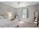 Bedroom with neutral walls, carpet flooring and view out the window at 213 Johnstons Dr, Dallas, GA 30157