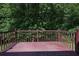 Wooden deck overlooking a lush backyard at 213 Johnstons Dr, Dallas, GA 30157