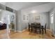 Open dining room with hardwood floors, natural light and views to the living room, ideal for Gathering meals and gatherings at 213 Johnstons Dr, Dallas, GA 30157