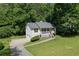 Charming home featuring a well-manicured front lawn and welcoming porch at 213 Johnstons Dr, Dallas, GA 30157