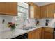 Charming kitchen featuring granite countertops, wood cabinets, stainless steel appliances, and a double bowl sink at 213 Johnstons Dr, Dallas, GA 30157