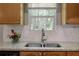 Charming kitchen featuring granite countertops, wood cabinets, stainless steel appliances, and a double bowl sink at 213 Johnstons Dr, Dallas, GA 30157