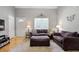 Comfortable living room featuring a hardwood floor, neutral gray walls, and ample natural light from the large window at 213 Johnstons Dr, Dallas, GA 30157