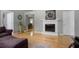 Bright living room with hardwood floors, a fireplace, and views into the dining area, great for entertaining guests at 213 Johnstons Dr, Dallas, GA 30157
