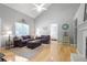 Spacious living room with hardwood floors, high ceilings, and comfortable seating, perfect for Gathering gatherings at 213 Johnstons Dr, Dallas, GA 30157