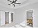 Bright bedroom features neutral carpet, ceiling fan, and convenient access to the ensuite bathroom and walk-in closet at 2592 Alcovy Ne Trl, Marietta, GA 30066