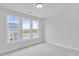 Bright bedroom featuring large windows offering neighborhood views and neutral carpeting at 2592 Alcovy Ne Trl, Marietta, GA 30066
