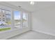 Bright bedroom with plush carpeting, and natural light from three large windows overlooking the neighborhood at 2592 Alcovy Ne Trl, Marietta, GA 30066