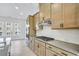 Spacious kitchen boasts stainless steel appliances, ample counter space, and stylish light wood cabinets at 2592 Alcovy Ne Trl, Marietta, GA 30066