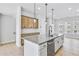 Stylish kitchen with shaker cabinets, large island, stainless steel appliances, and pendant lighting at 2592 Alcovy Ne Trl, Marietta, GA 30066