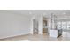 Spacious living area connected to the kitchen, featuring light hardwood floors and natural lighting at 2592 Alcovy Ne Trl, Marietta, GA 30066