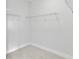 A walk-in closet with wire shelving, carpeted floor, and neutral paint is ready for storage and organization at 2592 Alcovy Ne Trl, Marietta, GA 30066