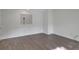 Spacious bedroom featuring luxury vinyl plank flooring, neutral walls and ample natural light at 293 Quail Run, Roswell, GA 30076