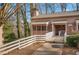 Charming townhome with a cozy screened porch and inviting walkway, perfect for enjoying quiet moments at 293 Quail Run, Roswell, GA 30076