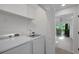 Convenient laundry area with modern washer and dryer, providing functional space in the home at 293 Quail Run, Roswell, GA 30076