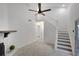 Comfortable living space featuring a stone fireplace, staircase and access to a serene screened porch at 293 Quail Run, Roswell, GA 30076
