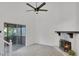 Bright living area with stone fireplace and sliding doors to screen porch for seamless indoor-outdoor living at 293 Quail Run, Roswell, GA 30076