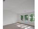 Spacious living room with new floors and lots of natural light at 293 Quail Run, Roswell, GA 30076