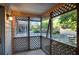 Cozy screened-in porch with American flag and lattice details at 293 Quail Run, Roswell, GA 30076