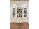 Custom-built white bar with shelving, cabinets, sink, and decorative items for entertaining at 1018 Layfield Ct, Dunwoody, GA 30338