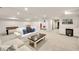 Spacious finished basement with stylish furnishings, wood paneling, and plenty of light at 1018 Layfield Ct, Dunwoody, GA 30338