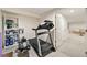 Home gym in the basement, featuring a treadmill and rowing machine at 1018 Layfield Ct, Dunwoody, GA 30338