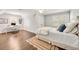 Bright bedroom with dark wood floors, home office area, and neutral decor at 1018 Layfield Ct, Dunwoody, GA 30338