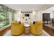 Cozy sitting room with built-in cabinets, large windows, and comfortable seating at 1018 Layfield Ct, Dunwoody, GA 30338