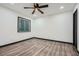 Clean and modern bedroom with modern flooring, ceiling fan, and neutral walls at 11 Peyton Place Sw, Atlanta, GA 30311
