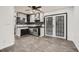 Stylish kitchen featuring stainless steel appliances, black countertops, and ample cabinet space at 11 Peyton Place Sw, Atlanta, GA 30311