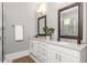 Bathroom with marble countertops, and sinks and a glass enclosed shower at 1202 Hardee Ne St, Atlanta, GA 30307