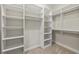 Walk-in closet with built-in shelves and plenty of storage space at 1202 Hardee Ne St, Atlanta, GA 30307